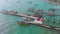 Birds eye landscape of pier and colorful long tail boats nearby the ocean in Koh Rong Island near Sihanoukville in Cambodia