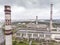 Birds eye view of city heat power station against overcast sky