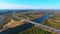 Birds eye view of highway road over river. Aerial view road bridge over water