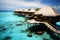 Birds eye view of Maldives water villas, wooden pier