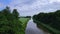 Birds eye view over a canal and woodlands in the Dutch countryside