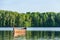 Birds on a fishing boat in a forest lake