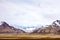 Birds flying between mountains in arctic summer landscape