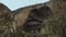 Birds Flying Near A Rocky Mountain