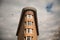 Birds flying over beautiful bricks building