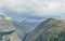 Birds flying over the peaks of the mountains during cloudy day in Canadian Rockies along the Icefields Parkway