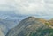 Birds flying over the peaks of the mountains during cloudy day in Canadian Rockies along the Icefields Parkway