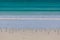 Birds perching on white sand of Cape Bridgewater ocean beach, Australia.