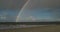 Birds with Rainbow on North Frisian Island Beach of Amrum