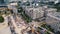 Birdseye view of construction site with cranes next to residential areas in the center of Warsaw Poland. Streets