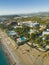 Birdseye view of wealthy beachside resort area of Ocurcalar, Turkey with mountains in the background. Bright summer