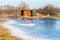 Birdwatching hide in dutch frozen Rammelwaard landscape