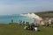 Birling gap beach and Seven Sisters white chalk cliffs with people enjoying the view