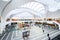 Birmingham Grand Central Station interior wide angle commuters and tourists waiting for trains modern futuristic design