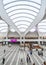 Birmingham Grand central Station Interior wide angle commuters and tourists waiting for trains modern futuristic design shops