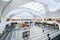 Birmingham Grand central Station Interior wide angle commuters and tourists waiting for trains modern futuristic design shops