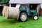 BIRMINGHAM, UK - March 2018 Mini Truck with Two Sheaves of Rolled Dry Hays at the Back. Warehouse Storage for Harvested