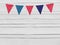 Birthday, baby shower mockup scene. Party flags decoration. Wooden background. Empty space, top view.