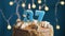 Birthday cake with 37 number candle on blue backgraund