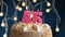 Birthday cake with 45 number pink burning candle on blue background. Candles blow out. Slow motion and close-up view