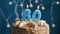 Birthday cake with 60 number candle on blue backgraund