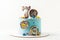 Birthday cake for a boy with blue cream cheese frosting decorated with gingerbread cookies in the shape of spinning top of popular