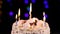 Birthday cake with burning candles