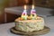 Birthday cake. Candles burn in the form of numbers 45.