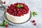 Birthday cake with cream and raspberries