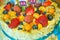 Birthday cake with fresh fruit and berries