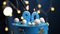 Birthday cake number 90 stars sky and moon concept, blue candle is fire by lighter. Copy space on right side of screen. Close-up