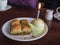 Birthday candle in a scoop of ice cream and bakalava