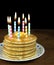 Birthday candles on pancake stack