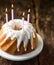 Birthday candles on a twirled vanilla ring cake