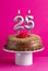 Birthday card with candle number 25 - Chocolate cake on pink background