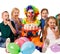Birthday child clown playing with children. Kid holiday cakes celebratory.