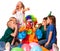 Birthday clown close ears of children`s noise with group children.