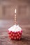 Birthday cupcake blurry background with lots of lit candles