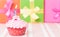 Birthday cupcake with burning candle