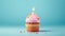 Birthday cupcake with a candle  on light blue background with balloons. Generative Ai