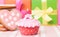 Birthday cupcake with candle and presents