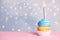 Birthday cupcake with candle on table against festive , space for text