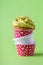 Birthday cupcake in funny polka dot red and white colorful cups stack