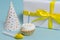 birthday cupcakes, festive horn and gift on blue isolated background