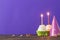 Birthday cupcakes on violet background