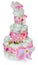 Birthday diapers cake decorated with bow, children`s shoes, cart