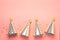 Birthday holiday party concept. Striped golden cones hats and confetti