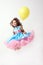 Birthday. Little girl. Yellow balloon. Blue dress