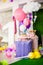 Birthday party concept, candy bar for children. Huge number one, table with sweets and desserts, cloud from balloons and ice-cream