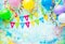 Birthday party frame with balloons, streamers and confetti on colorful background with copy space